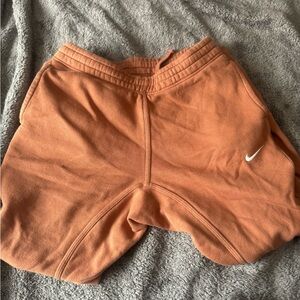 men’s orange nike joggers
